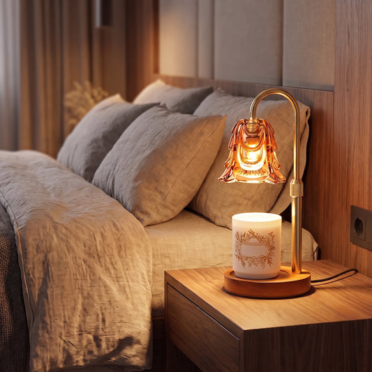 Candle warmer lamp glowing over a jar candle on a walnut nightstand