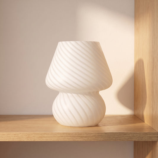 Frosted glass mushroom table lamp on an oak shelf in soft morning light