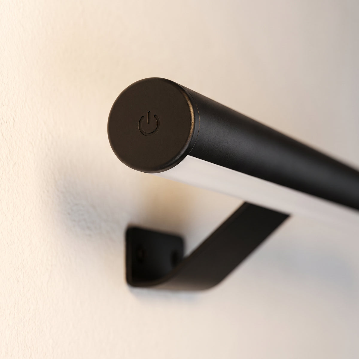 Macro of the matte black end cap with the touch symbol