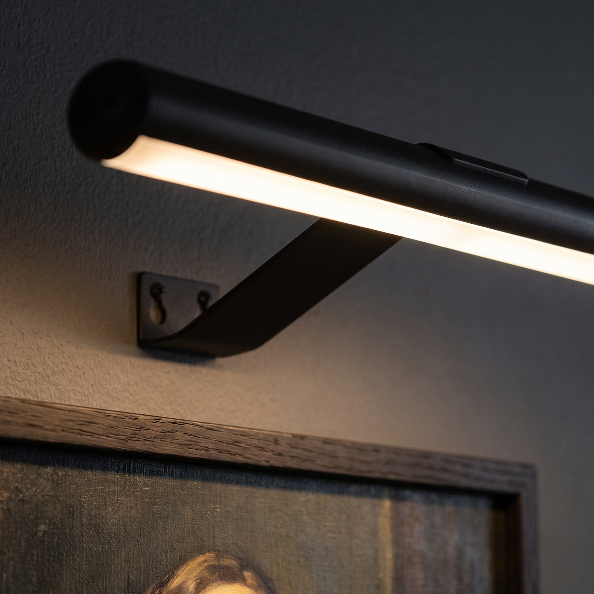 Close-up of the lit frosted strip washing light onto a picture frame