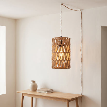 Rattan plug-in pendant light with Edison bulb glowing in a bright interior