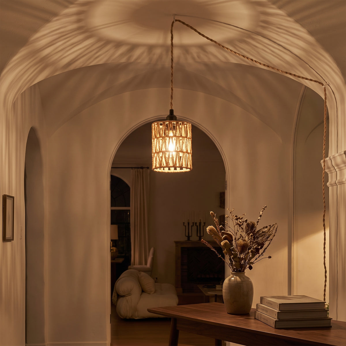 Woven shadow patterns cast on the wall by the rattan pendant at night