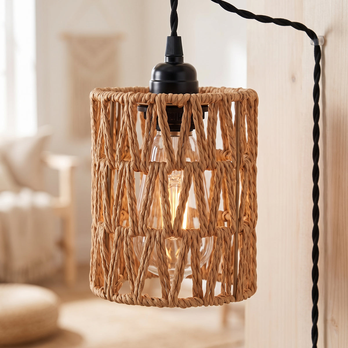Close-up of the open rattan weave and socket of the pendant light