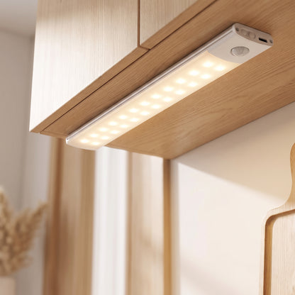 Close-up of the under-cabinet light bar with LED rows and motion sensor
