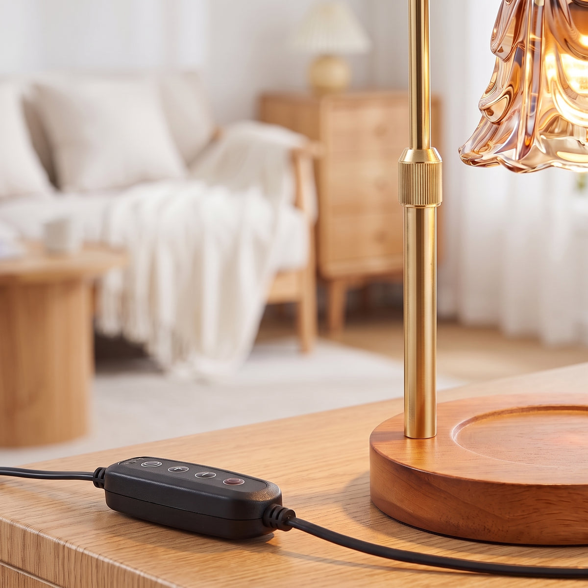 Close-up of the wooden base, brass stem and inline dimmer of the candle warmer lamp