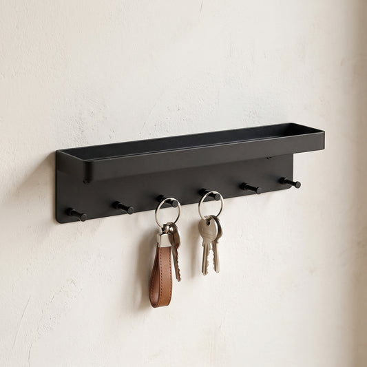 Matte black wall-mounted entryway organizer — close view