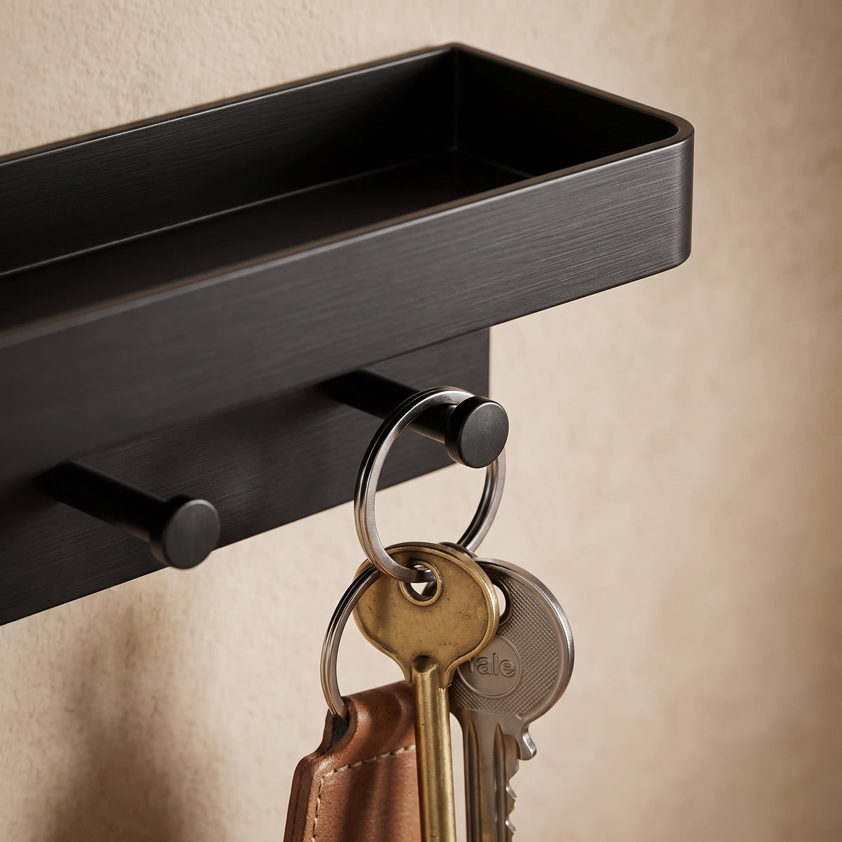 Macro of matte black hooks on the entryway organizer