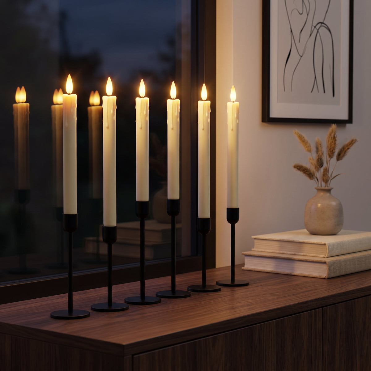 Flameless LED taper candles on a walnut console beneath a dark window in the evening